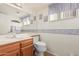 Small bathroom with single vanity, toilet, and decorative border at 1918 E Hearn Rd, Phoenix, AZ 85022