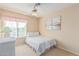 Bedroom with a twin bed, ceiling fan, and window coverings at 1918 E Hearn Rd, Phoenix, AZ 85022