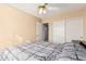 Bedroom with double bed, ceiling fan, and sliding door closet at 1918 E Hearn Rd, Phoenix, AZ 85022