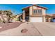 Two-story house with a large garage and desert landscaping at 1918 E Hearn Rd, Phoenix, AZ 85022