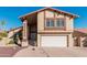 Two-story house with a large garage and desert landscaping at 1918 E Hearn Rd, Phoenix, AZ 85022