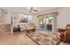 Bright living room with tiled floors, comfy seating, and sliding glass doors leading to a patio at 1918 E Hearn Rd, Phoenix, AZ 85022