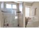 Clean bathroom with a glass-enclosed shower and tile flooring at 19222 N 70Th Ave, Glendale, AZ 85308