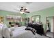 Bright bedroom featuring a ceiling fan and ample closet space at 19222 N 70Th Ave, Glendale, AZ 85308