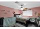 Cozy bedroom with leopard print bedding and a ceiling fan at 19222 N 70Th Ave, Glendale, AZ 85308