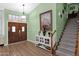 Elegant entryway with wood floors, double doors, and staircase at 19222 N 70Th Ave, Glendale, AZ 85308