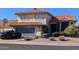 Two-story house with tile roof, attached garage, and basketball hoop at 19222 N 70Th Ave, Glendale, AZ 85308