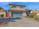 House exterior showcasing green garage door and basketball hoop at 19222 N 70Th Ave, Glendale, AZ 85308