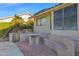 Outdoor patio area with built-in seating and a grill at 19222 N 70Th Ave, Glendale, AZ 85308