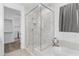 Modern bathroom with a frameless glass shower and marble tile at 19961 W Heatherbrae Dr, Litchfield Park, AZ 85340