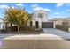 Two-story house with a landscaped front yard and attached garage at 19961 W Heatherbrae Dr, Litchfield Park, AZ 85340