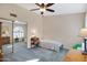 Bedroom features mirrored closet doors, neutral carpet, and a ceiling fan at 2059 E Brown Rd # 23, Mesa, AZ 85213