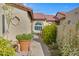 A cozy courtyard view with lush greenery, potted flowers, and seating, offering a tranquil outdoor space at 2059 E Brown Rd # 23, Mesa, AZ 85213