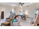 Cozy living room featuring a ceiling fan, neutral walls, and tile flooring at 2059 E Brown Rd # 23, Mesa, AZ 85213