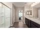 Double vanity bathroom with large shower and view to bedroom at 2071 E Piedmont Pl, Casa Grande, AZ 85122