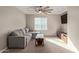 Cozy bedroom with L-shaped sofa and ceiling fan at 2071 E Piedmont Pl, Casa Grande, AZ 85122