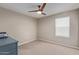 Bright bedroom with ceiling fan and window coverings at 2071 E Piedmont Pl, Casa Grande, AZ 85122