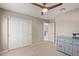 Bedroom with double doors and access to upper hallway at 2071 E Piedmont Pl, Casa Grande, AZ 85122