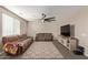 Living room with brown sectional sofa and large TV at 2071 E Piedmont Pl, Casa Grande, AZ 85122