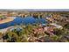 Aerial view of community clubhouse, pool, and lakefront property at 2265 E Mallard Ct, Gilbert, AZ 85234