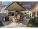 Outdoor kitchen and patio area with built-in bar and seating at 2265 E Mallard Ct, Gilbert, AZ 85234