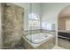 Elegant bathroom with soaking tub and walk-in shower at 2265 E Mallard Ct, Gilbert, AZ 85234