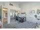 Bedroom with mirrored closet doors and a workspace at 2265 E Mallard Ct, Gilbert, AZ 85234