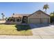 Two-car garage and front yard of single-story home at 2265 E Mallard Ct, Gilbert, AZ 85234