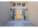 Front entry with yellow door and landscaping at 2265 E Mallard Ct, Gilbert, AZ 85234