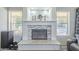 Elegant fireplace with a marble surround and built-in shelving at 2265 E Mallard Ct, Gilbert, AZ 85234