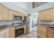 Modern kitchen with stainless steel appliances and wood cabinets at 2265 E Mallard Ct, Gilbert, AZ 85234