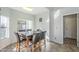 Bright kitchen nook with granite table and four chairs at 2265 E Mallard Ct, Gilbert, AZ 85234