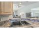 Kitchen sink and countertop detail with under-cabinet lighting at 2265 E Mallard Ct, Gilbert, AZ 85234