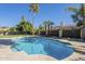 Large rectangular pool with a diving board and patio at 2265 E Mallard Ct, Gilbert, AZ 85234