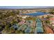 Aerial view of community tennis courts near lake and clubhouse at 2265 E Mallard Ct, Gilbert, AZ 85234