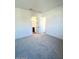 Bright bedroom with grey carpet and access to bathroom at 22910 E Alyssa Rd, Queen Creek, AZ 85142