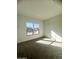 Well-lit bedroom featuring grey carpet and large windows at 22910 E Alyssa Rd, Queen Creek, AZ 85142