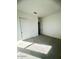 Spacious bedroom with grey carpet and double doors to closet at 22910 E Alyssa Rd, Queen Creek, AZ 85142