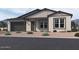 Single-story home with modern facade, two-car garage, and landscaped front yard at 22910 E Alyssa Rd, Queen Creek, AZ 85142