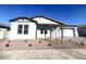 White house with gray accents, landscaping, and a two-car garage at 22910 E Alyssa Rd, Queen Creek, AZ 85142