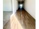 Long hallway with wood-look tile flooring and access to other rooms at 22910 E Alyssa Rd, Queen Creek, AZ 85142