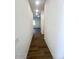 Bright hallway with wood-look tile floors at 22910 E Alyssa Rd, Queen Creek, AZ 85142