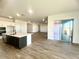 Modern kitchen with island, white cabinets, and hardwood floors at 22910 E Alyssa Rd, Queen Creek, AZ 85142