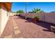 Landscaped backyard with gravel and a patio area at 2613 E Michigan Ave, Phoenix, AZ 85032