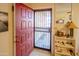 Inviting entryway with red door and security gate at 2613 E Michigan Ave, Phoenix, AZ 85032