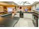 Modern kitchen featuring a breakfast bar and skylight at 2613 E Michigan Ave, Phoenix, AZ 85032