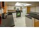 Clean kitchen with white cabinets and black countertops at 2613 E Michigan Ave, Phoenix, AZ 85032