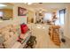 Bright living room featuring a comfy couch and a cat tree at 2613 E Michigan Ave, Phoenix, AZ 85032