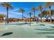 Community Splash Pad with palm trees and seating at 29402 W Mitchell Ave, Buckeye, AZ 85396