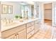 Elegant bathroom with double sinks and light wood cabinets at 3117 E Sierra Madre Way, Phoenix, AZ 85016